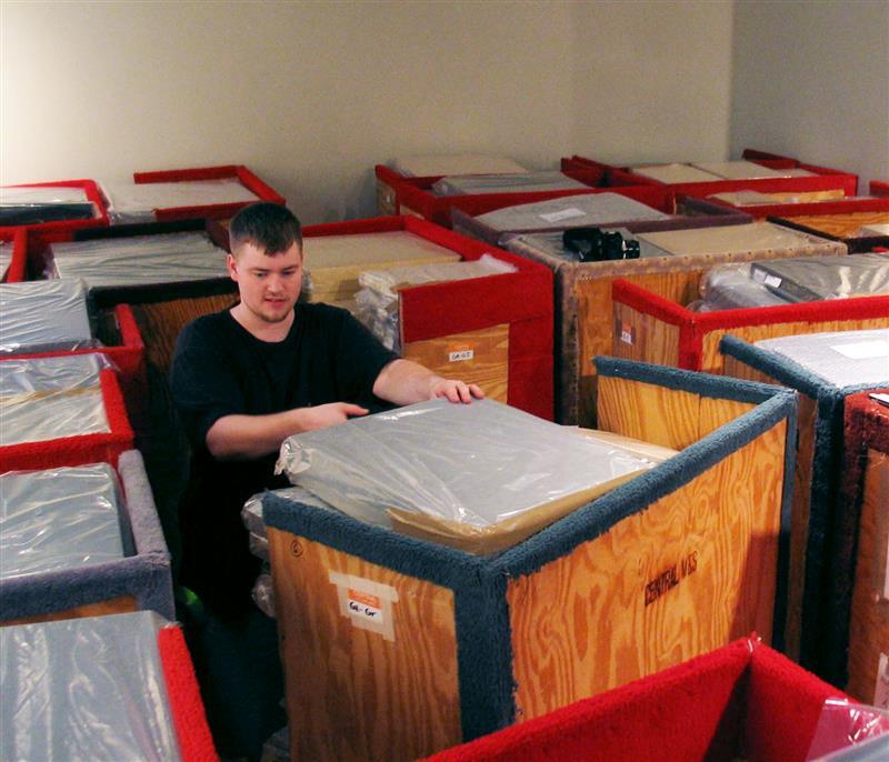 Image depicting Drew packing crates while working at HGG.