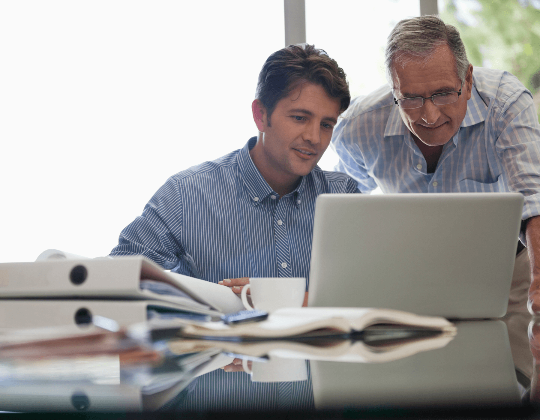 Decorative image of two colleagues looking at computer.